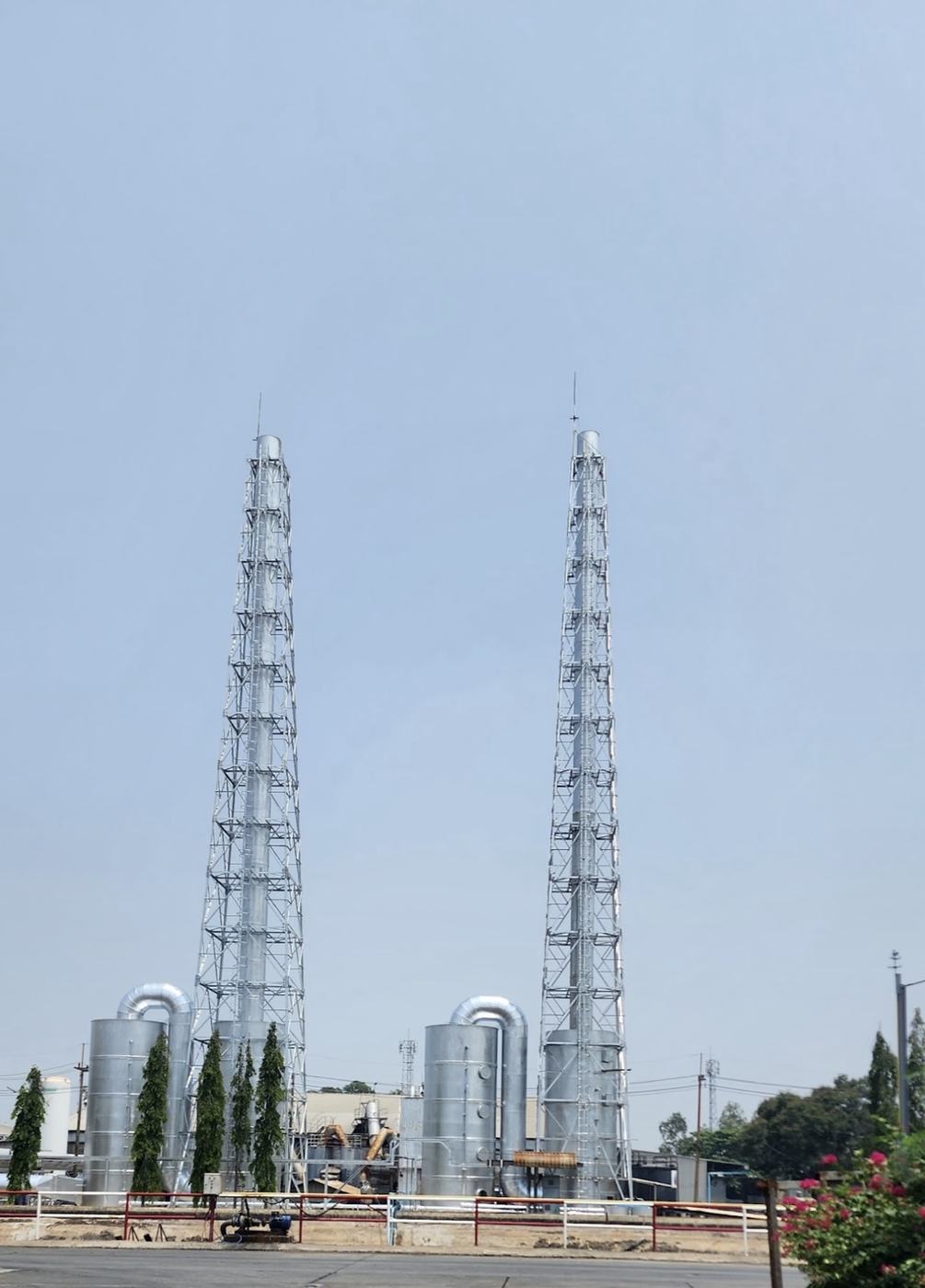 Twin exhaust stacks and scrubbers at the Saraburi plant